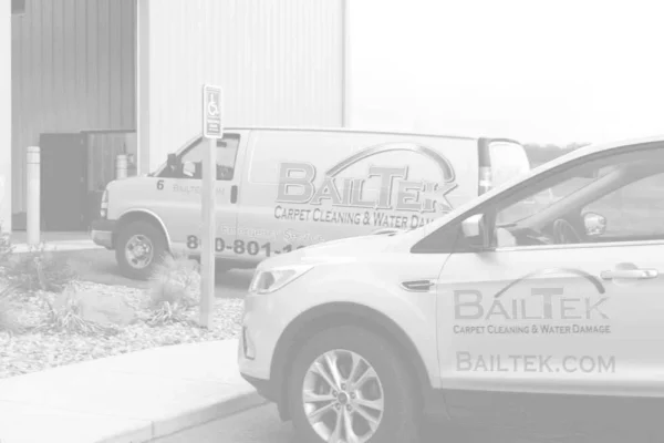 bailtek-carpet-cleaning-water-damage-van-and-car two bailtek vehicles